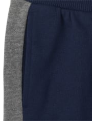 Pantalones jogger de vellón con rayas laterales para niños