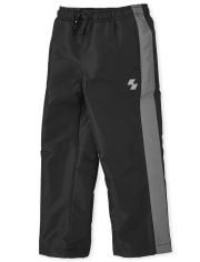 Pantalon coupe-vent à rayures latérales pour garçon