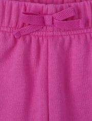 Pantalones jogger de forro polar con corazones arcoíris para niñas