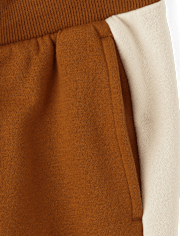 Pantalones jogger de polar con rayas laterales para niños