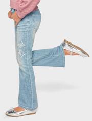Jeans acampanados con mariposa y diamantes de imitación para niñas