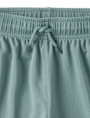 Short de sport enfant à séchage rapide et bandes latérales en maille