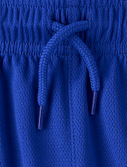 Short de sport enfant à séchage rapide et bandes latérales en maille