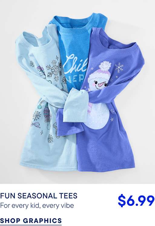 Three long-sleeved children's shirts in varying shades of blue with winter graphics are layered against a plain white background.
