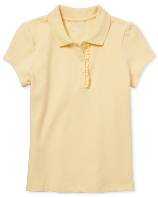 Polo de piqué con volantes de uniforme para niñas
