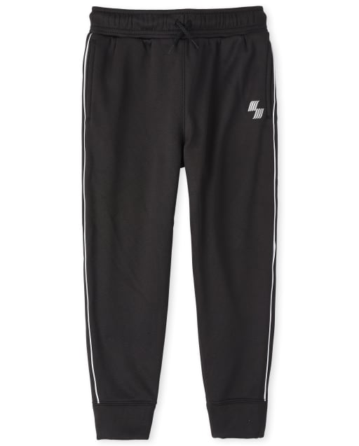 Pantalones jogger de malla con rayas laterales para niños