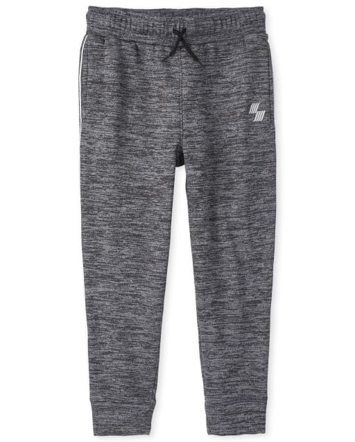 Pantalones jogger de malla con rayas laterales para niños