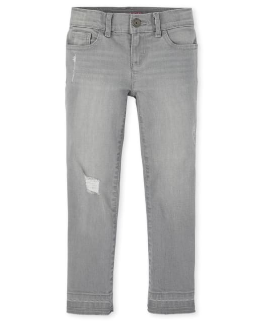 Jeans súper ajustados de mezclilla con dobladillo caído