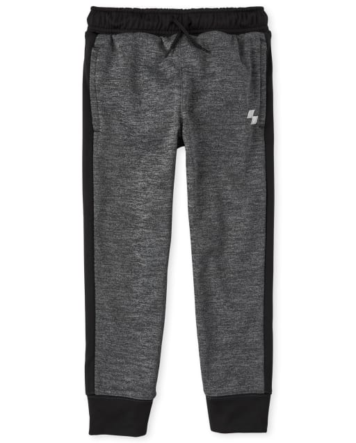 Pantalon de jogging performant à rayures latérales pour garçon