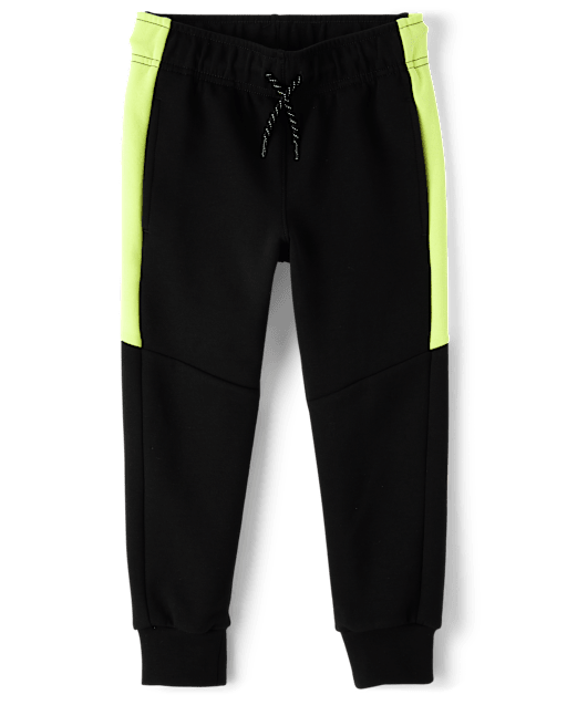 Pantalones jogger de neopreno con rayas laterales para niños