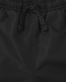 Pantalon coupe-vent à rayures latérales pour garçon