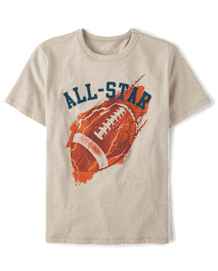 La imagen muestra una camiseta beige con un diseño gráfico que muestra un balón de fútbol y el texto "ALL-STAR" impreso en ella.