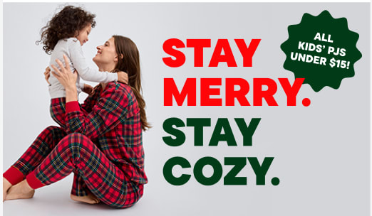 The image shows a person wearing a plaid shirt standing in front of a sign that reads "ALL KIDS' PJS UNDER $15!" and "STAY MERRY. STAY COZY."