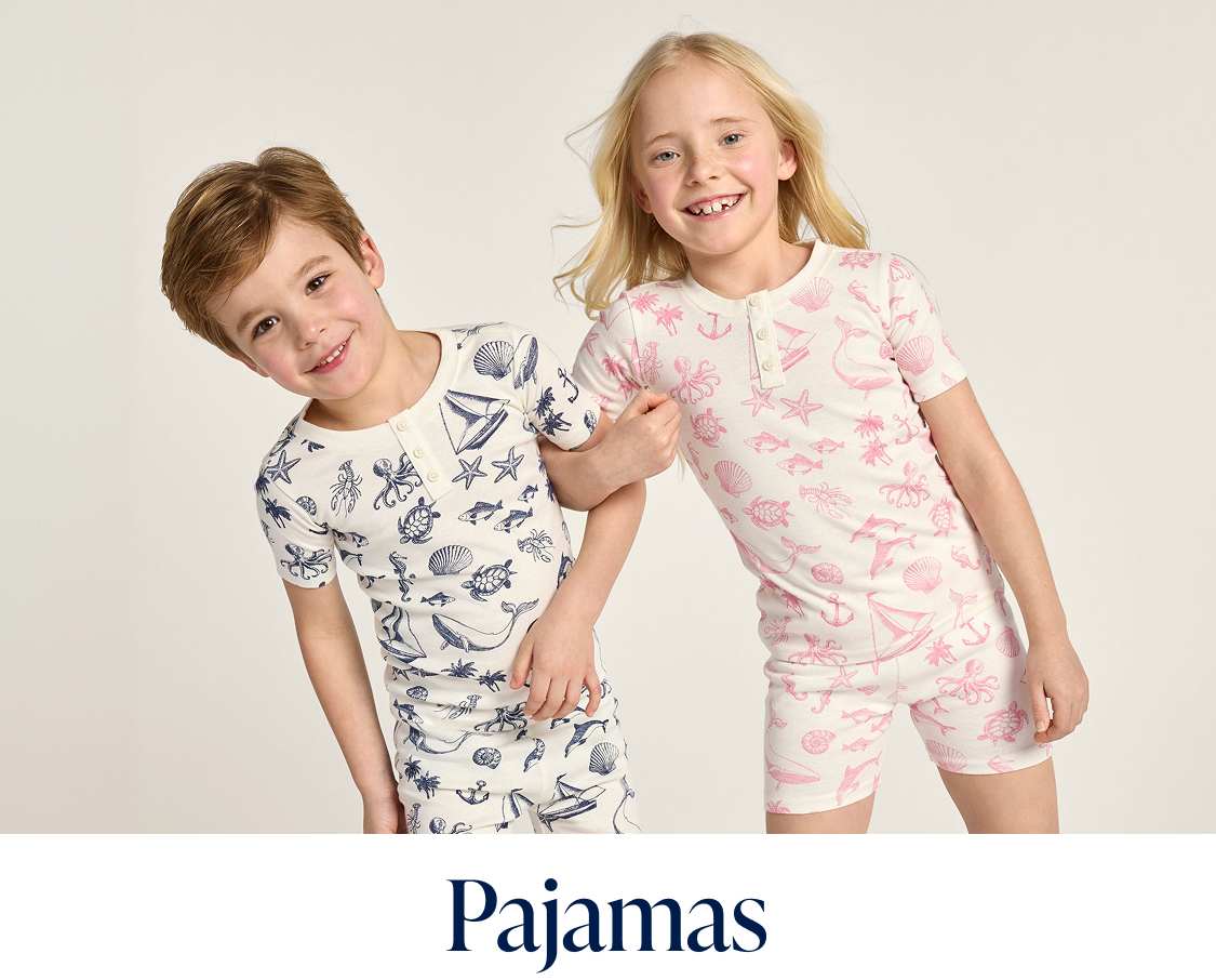 The image shows a collection of colorful and patterned pajamas, including a pink set with floral designs, a cream-colored set with animal prints, and a blue set with polka dots, all displayed against a plain background.
