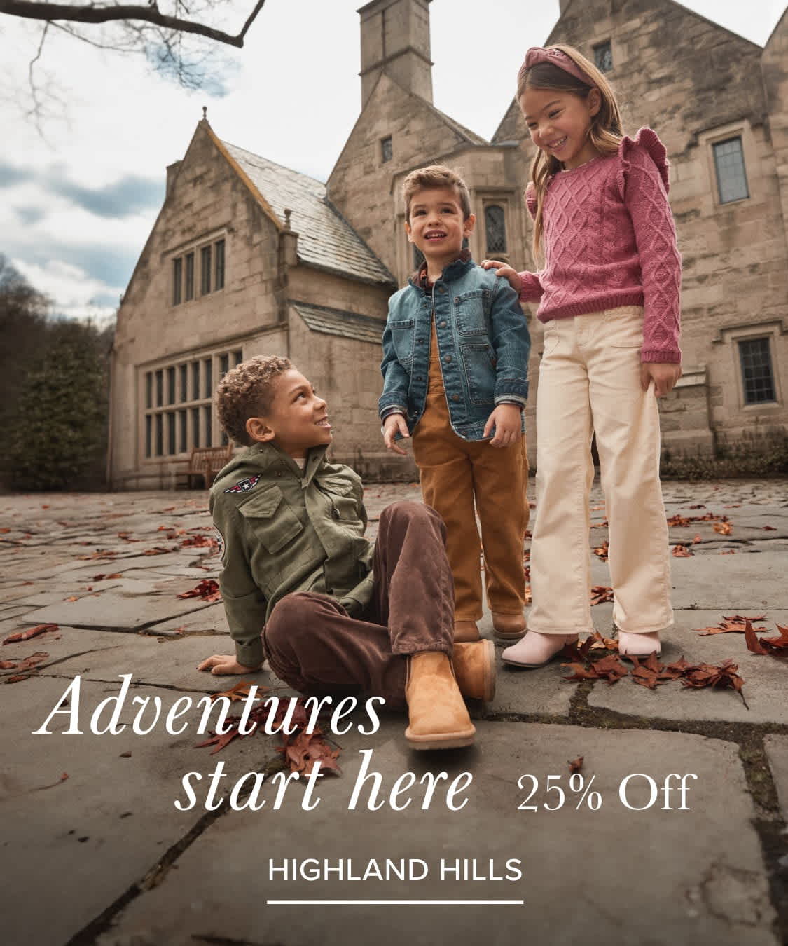 The image shows three children, a boy and two girls, standing in front of a large stone building with the text "Adventures start here" displayed prominently.