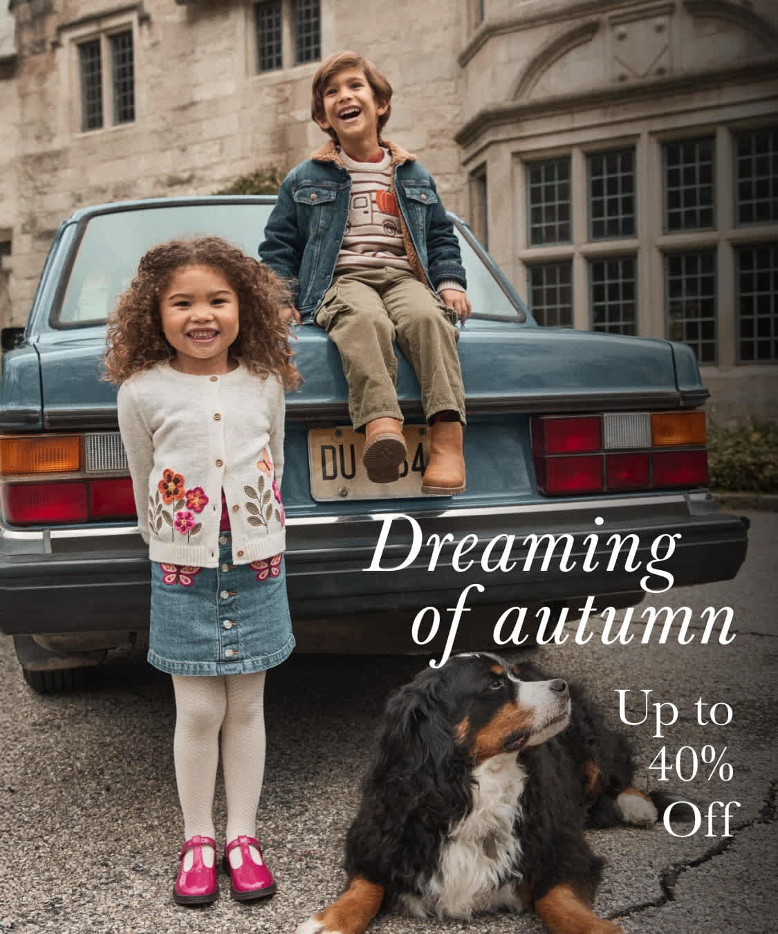 The image depicts a young woman standing in front of an old blue pickup truck, accompanied by a dog, in a setting that appears to be an old building or structure in the background, conveying a sense of dreaming of autumn.