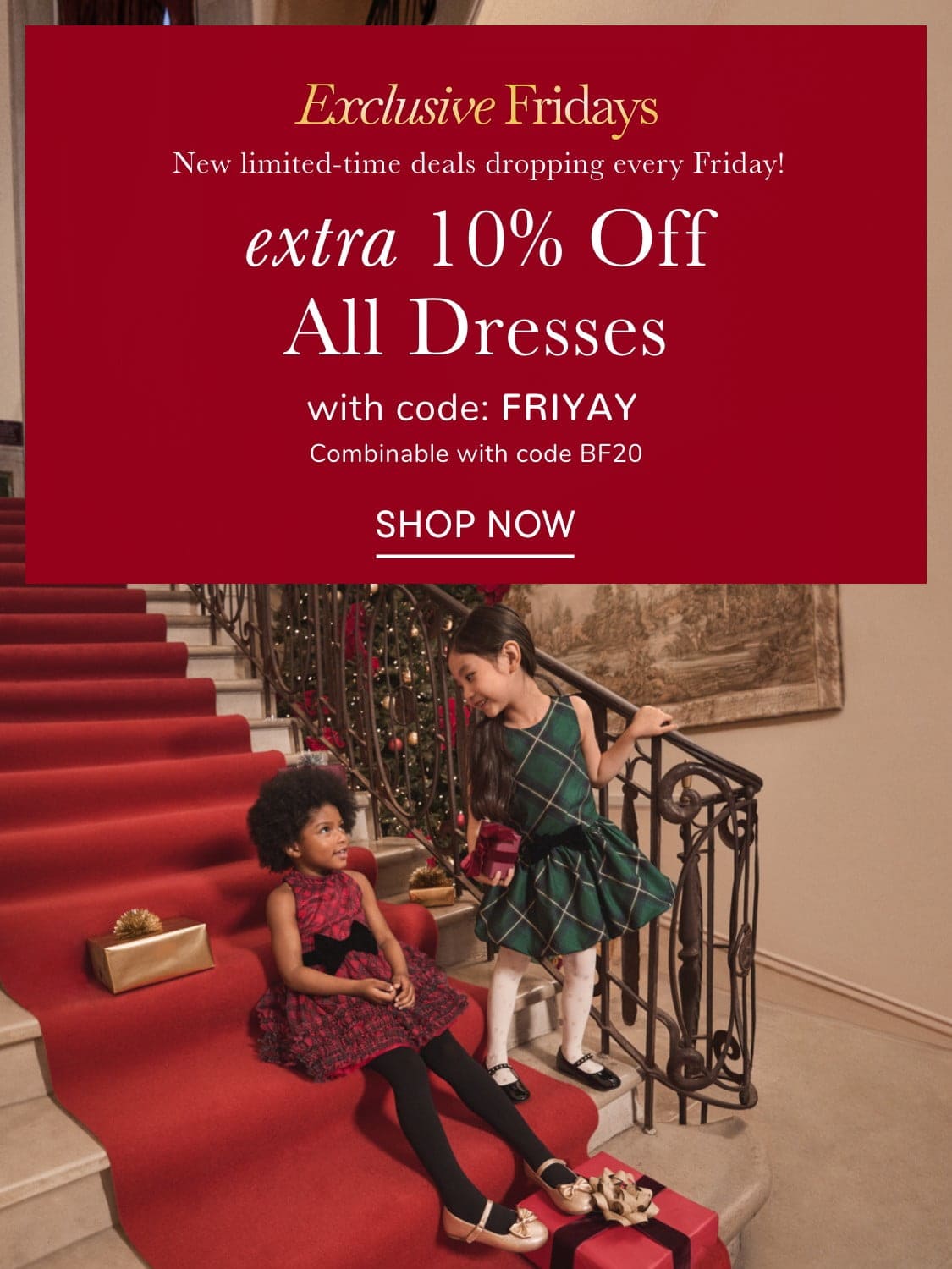 The image shows two people, a woman and a child, standing in front of a red advertisement banner for a clothing store's "Exclusive Fridays" promotion, offering an extra 10% off all dresses.