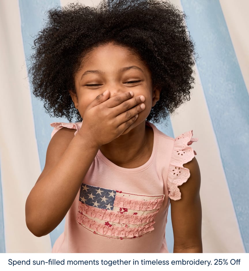 A young girl with curly hair is covering her mouth and smiling, set against a light blue background with a text overlay promoting a sale on embroidered products.