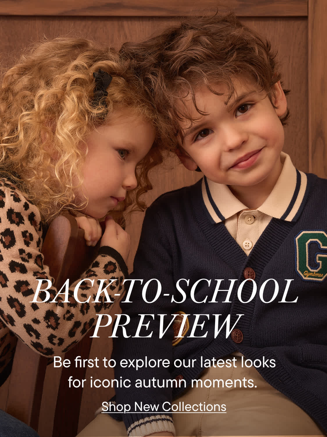 Two children, a girl with curly blonde hair and a boy with brown hair, are featured in the foreground against a wooden background, with "BACK-TO-SCHOOL PREVIEW" text overlayed.