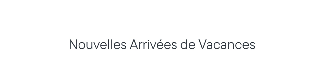 Le texte « Nouveautés pour les fêtes » est centré au premier plan sur un fond blanc uni.