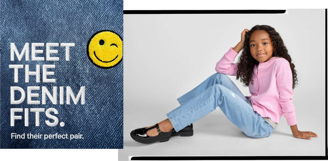 A young girl in a pink shirt and jeans sits on a white background, with a denim patch featuring text and a smiley face in the foreground.