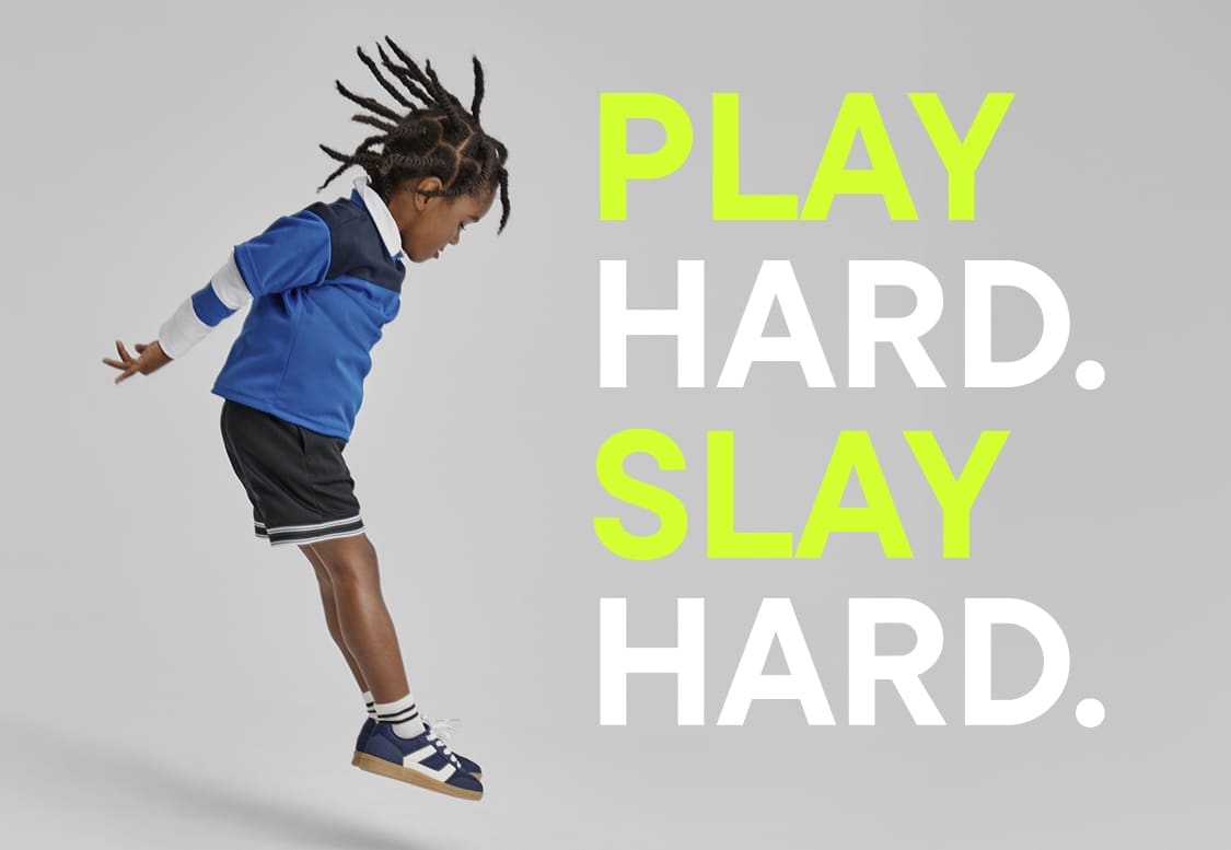 The image shows a pair of sneakers on a white background with the text "PLAY HARD SLAY HARD" written in large, neon-colored letters.