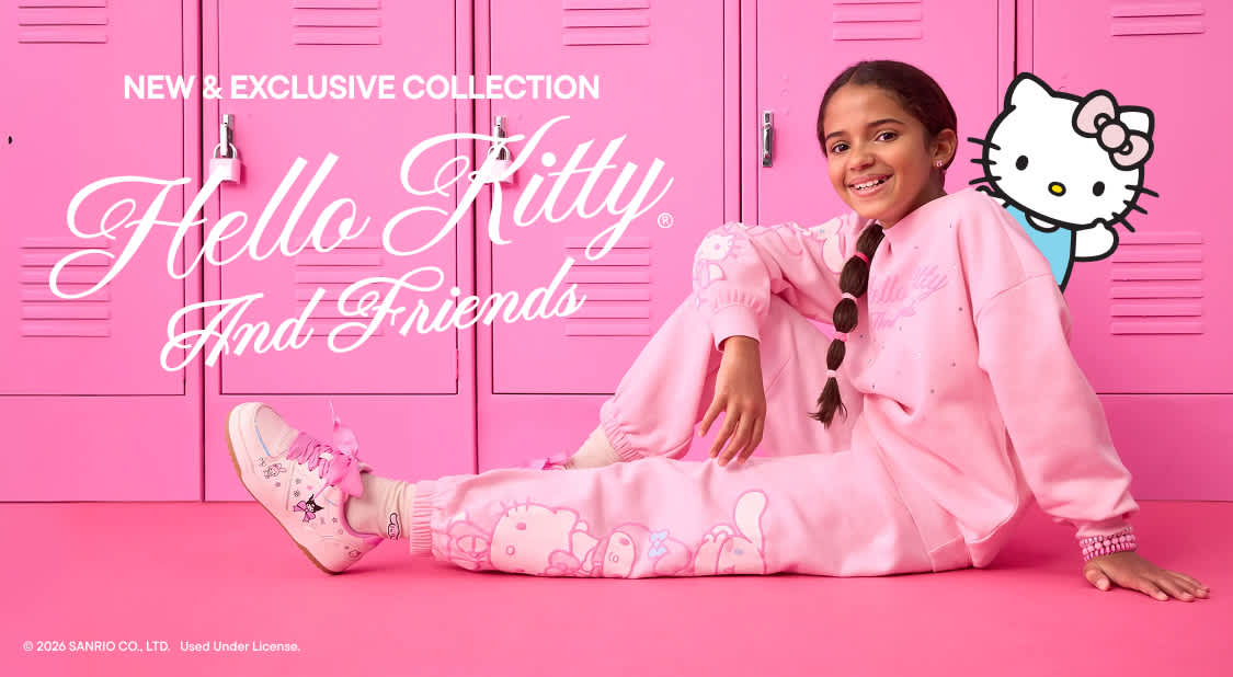 A young woman in a pink tracksuit sits in front of a row of pink lockers, with a Hello Kitty graphic peeking from behind her.