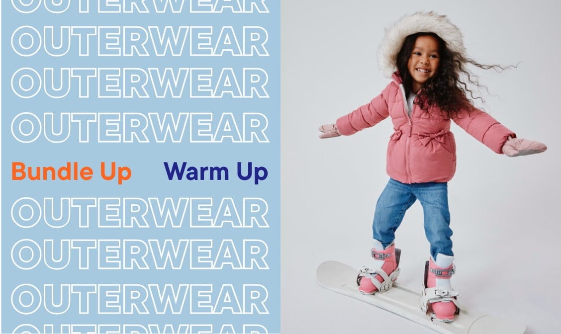 The image shows a young woman wearing a pink puffer jacket and jeans, standing on a skateboard in front of a background with the word "OUTERWEAR" repeated multiple times.