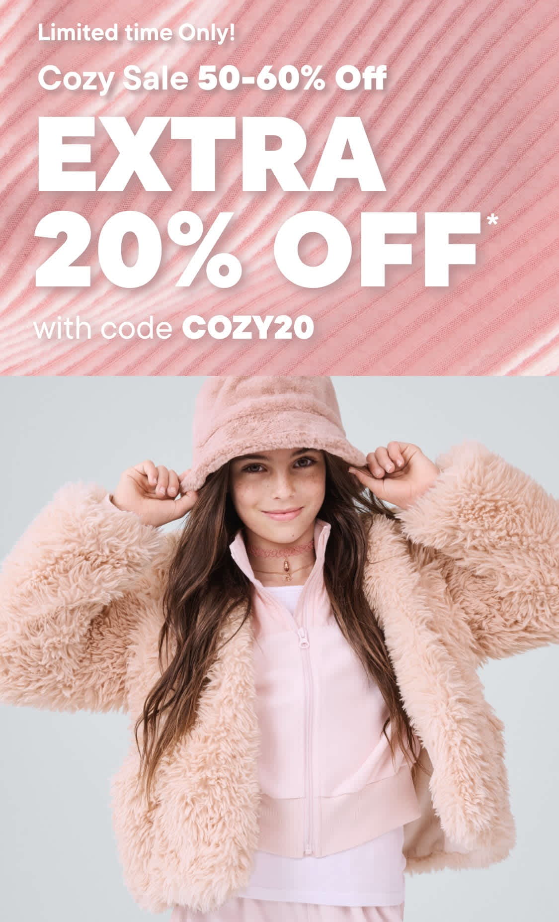 The image features a young woman wearing a cozy, furry jacket and a pink hat, standing against a plain background with a promotional message for a limited-time sale offering an extra 20% off.