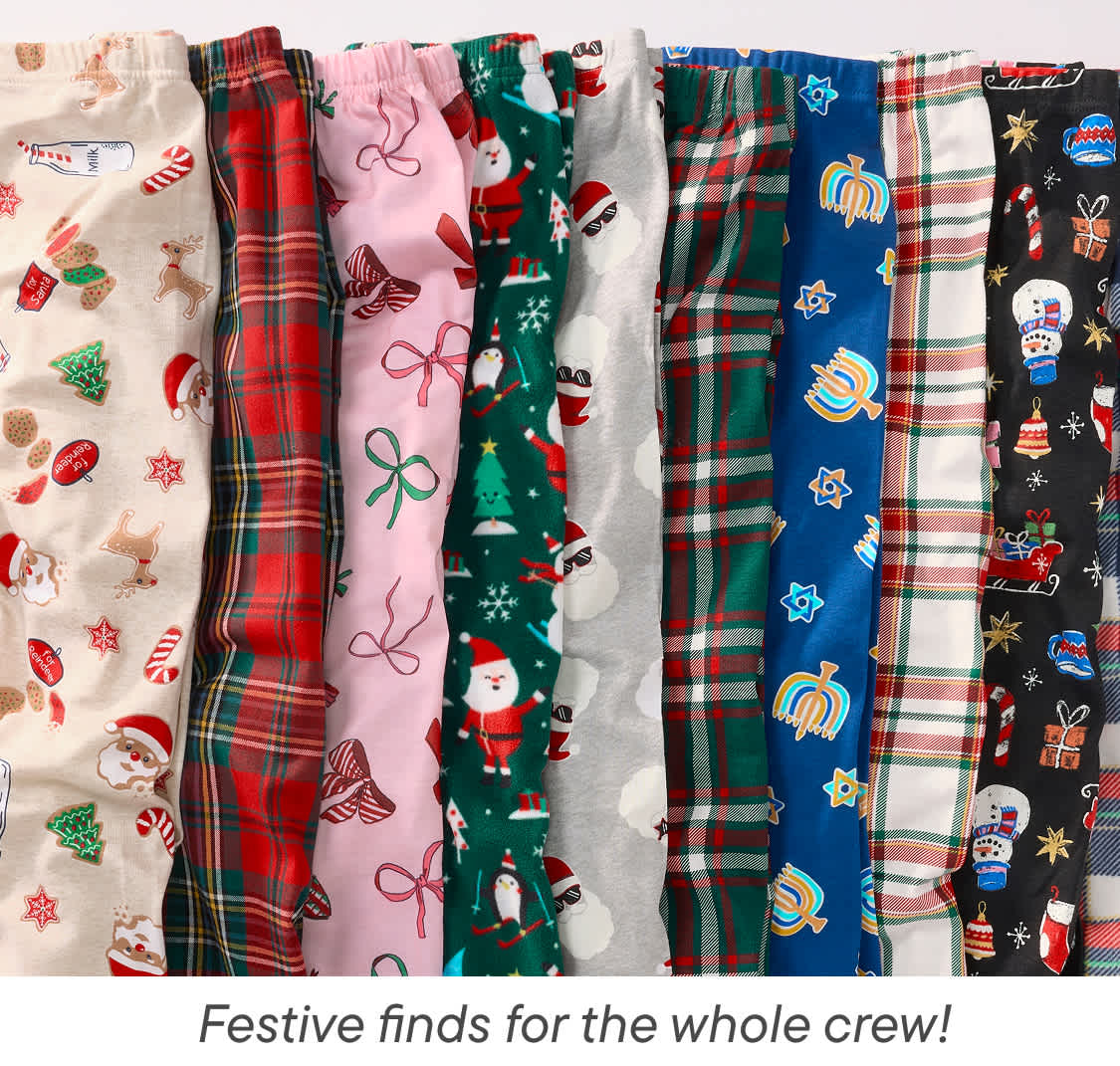 A collection of colorful and festive-themed pajama bottoms or leggings, showcasing various holiday patterns and designs, including plaid, snowflakes, Santa Claus, and other Christmas-inspired motifs.