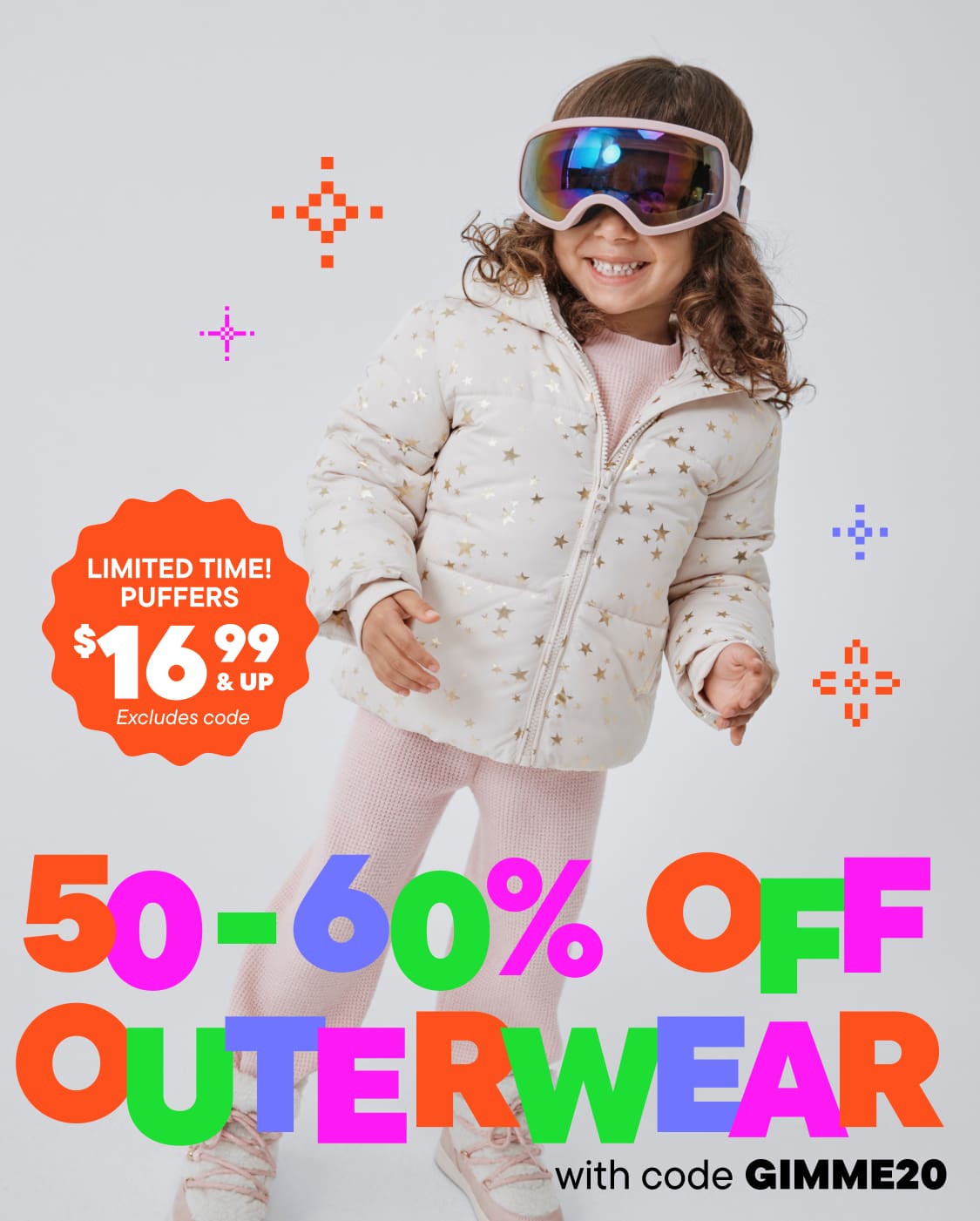 A young girl wearing a white polka-dotted jacket and ski goggles stands in front of a plain background, with various colorful graphics and a promotional offer for 50-60% off outerwear.