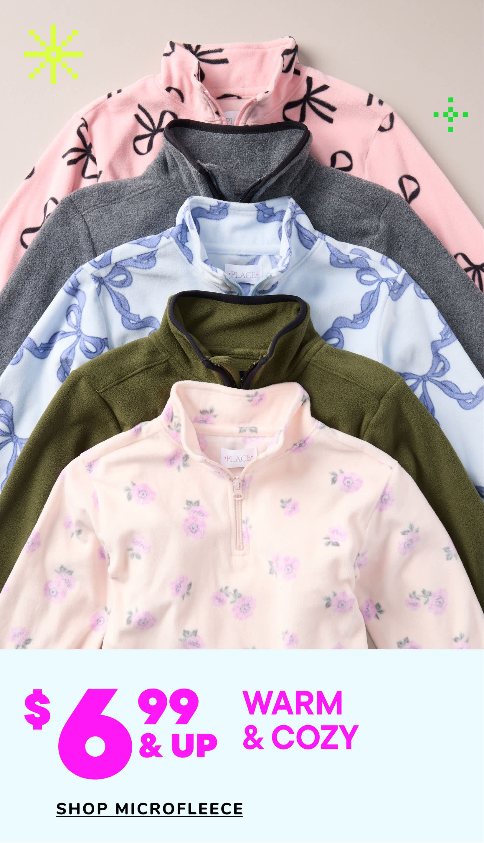 A collection of cozy and warm microfleece clothing items, including hoodies and pullovers, in various pastel and neutral colors, displayed against a plain background.