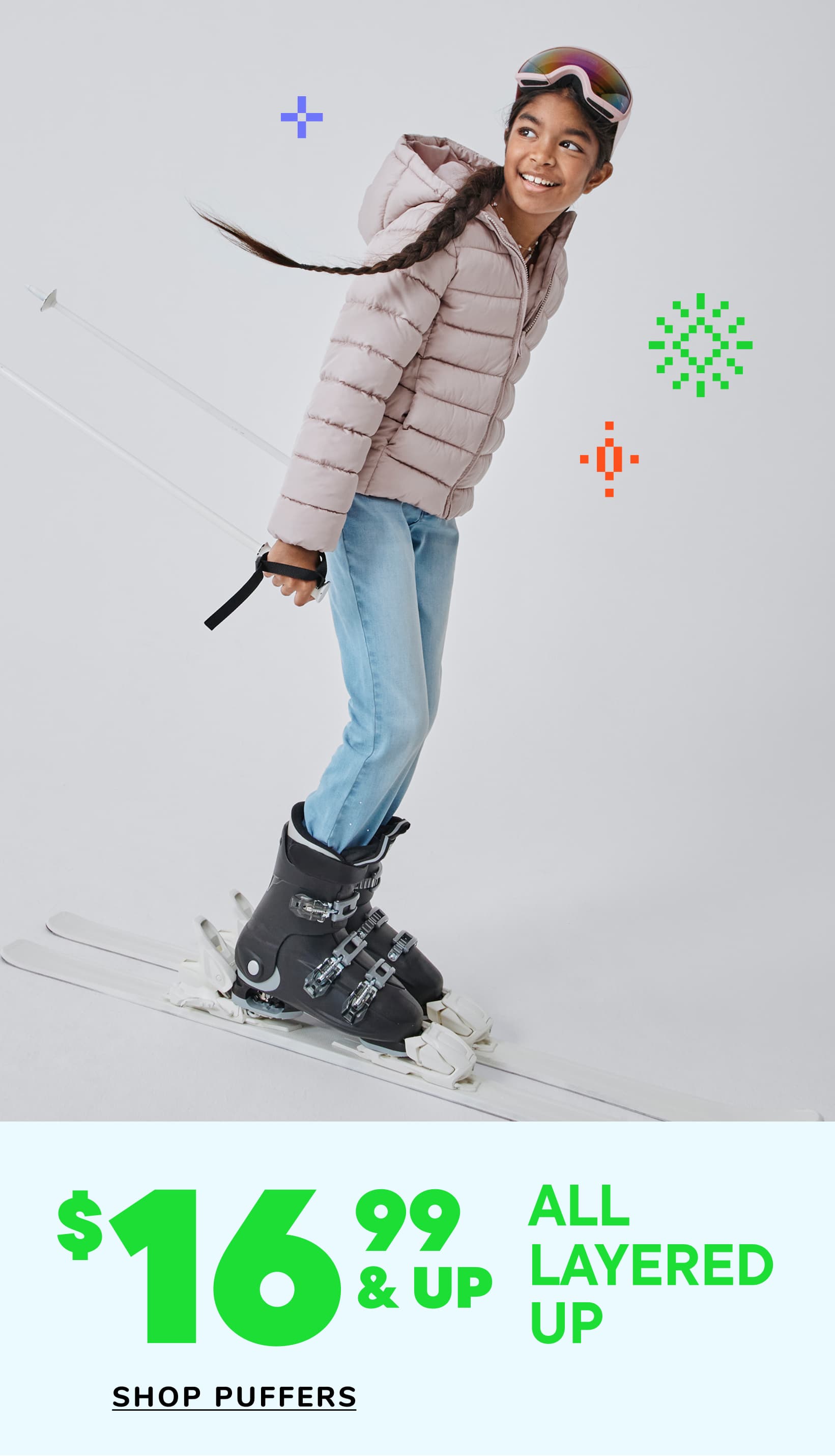 A young child with curly hair wearing a navy blue puffy jacket is smiling and laughing in front of a white background with various icons and pricing information.