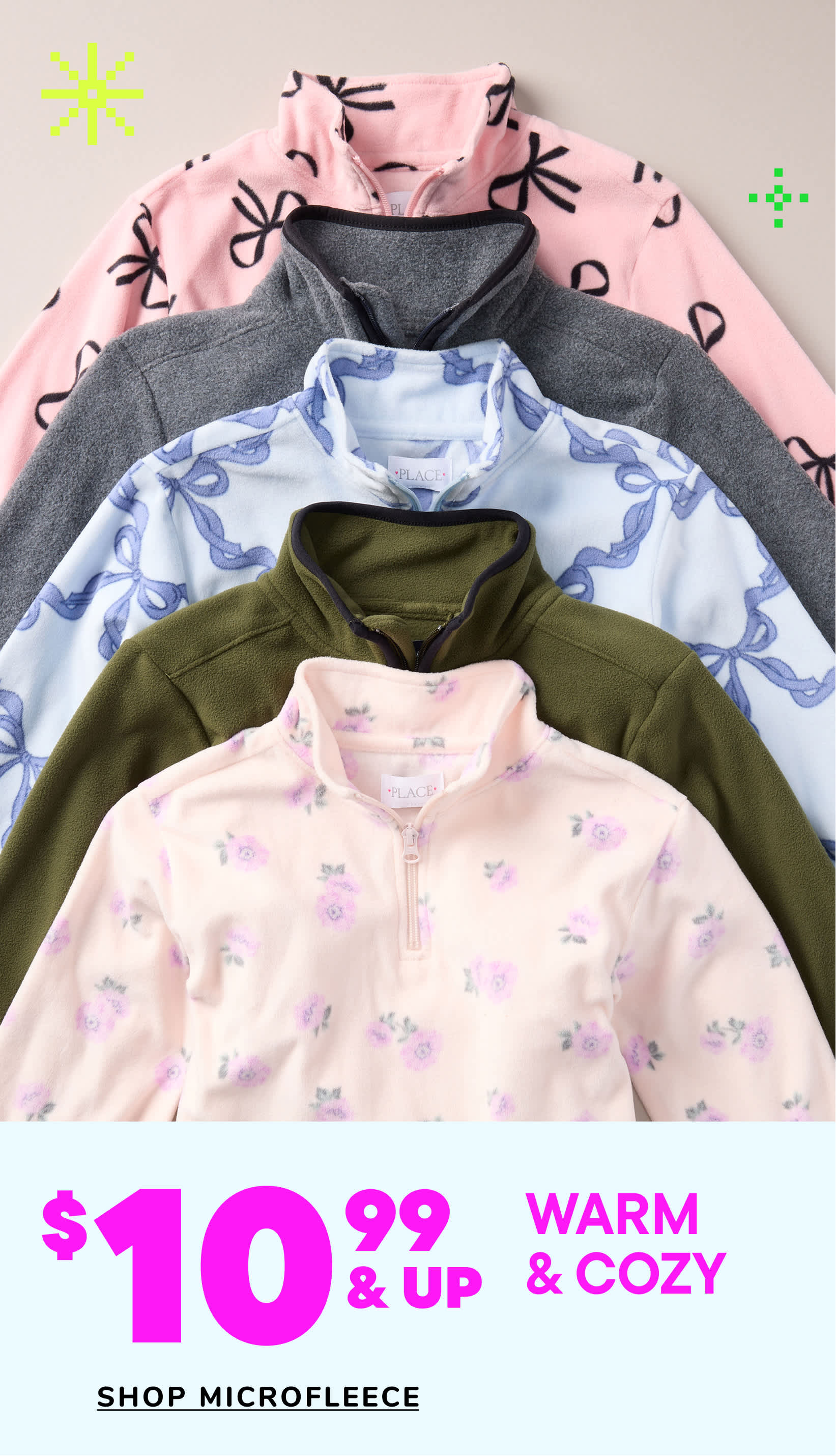 A collection of warm and cozy microfleeced clothing items, including hoodies and pullovers, in various pastel colors and floral patterns, displayed against a plain background.