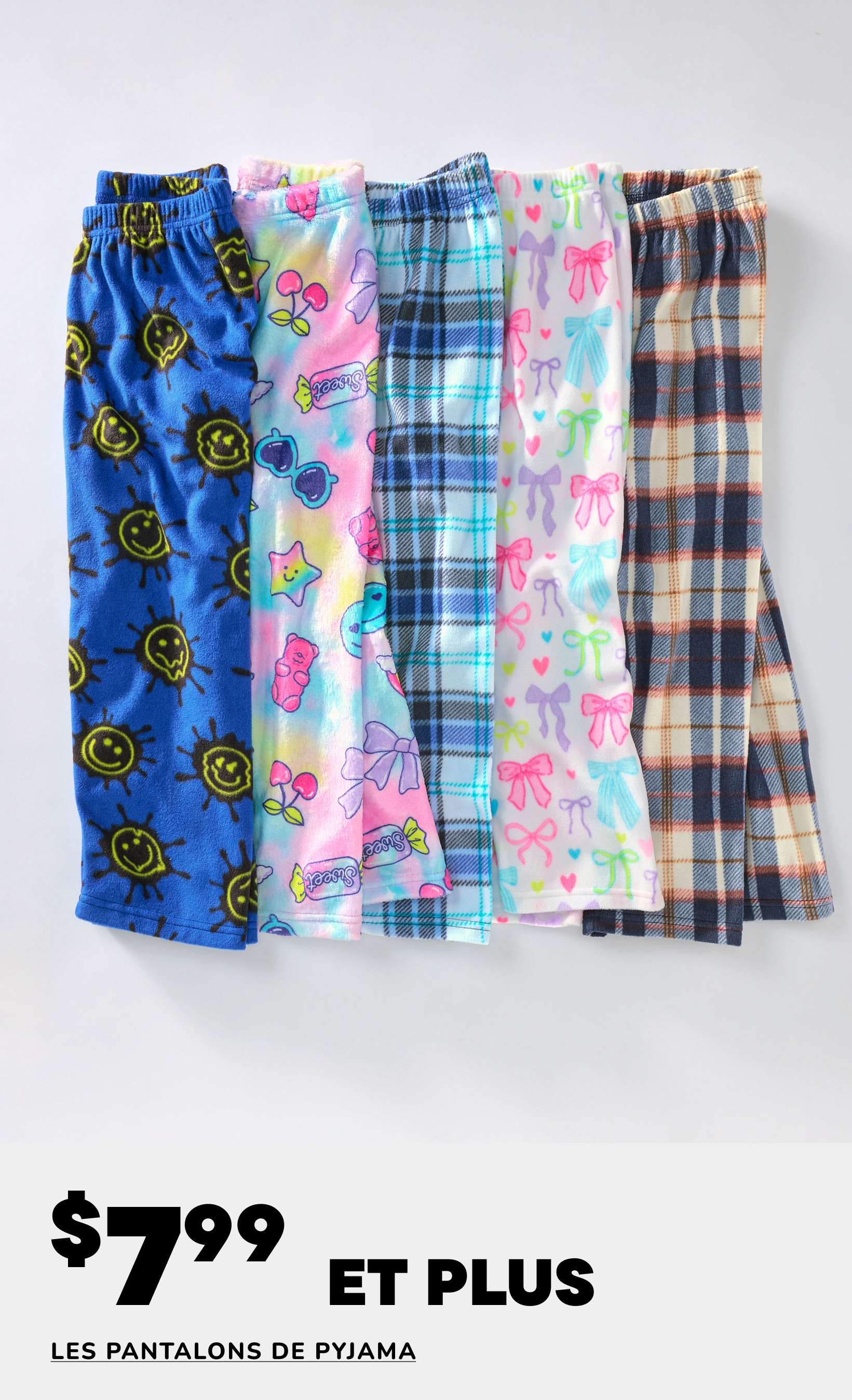Une collection de pantalons de pyjama colorés et à motifs, comprenant des modèles avec des visages souriants, des papillons et des carreaux, est présentée sur un fond blanc uni avec un prix de 7,99 $ et plus.