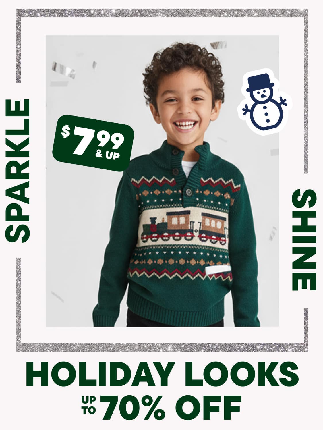 The image shows a young boy with curly hair wearing a green and red patterned sweater, smiling at the camera against a plain white background. The image also includes text advertising holiday looks at up to 70% off.