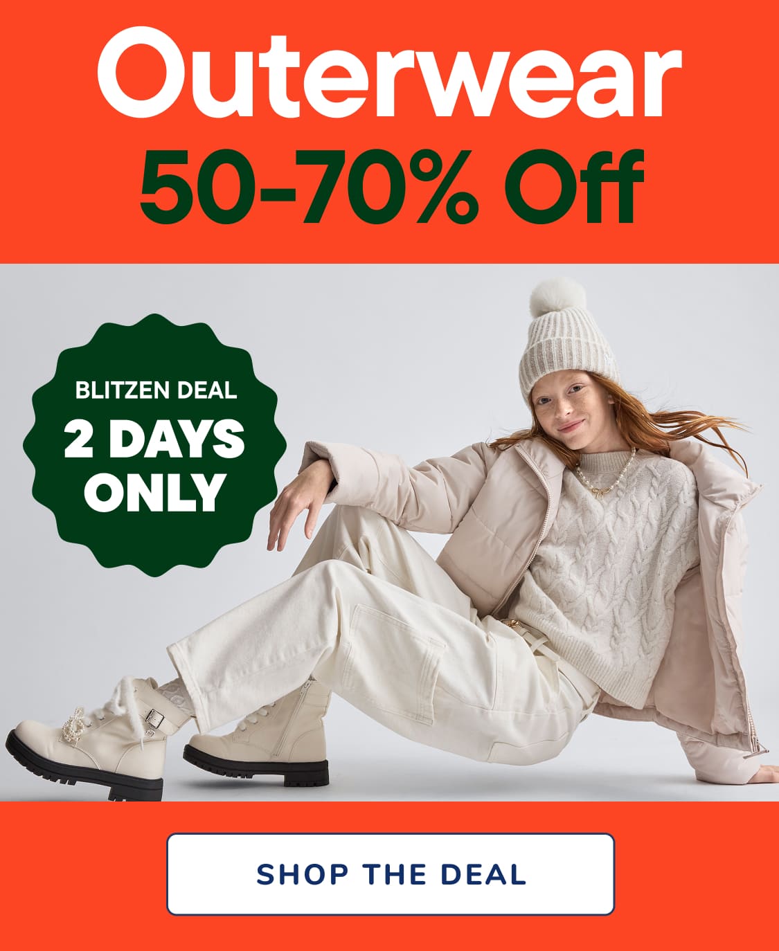 The image displays a large red sign with the text "Outerwear -70% Off" prominently displayed, indicating a sale or discount on outerwear products.