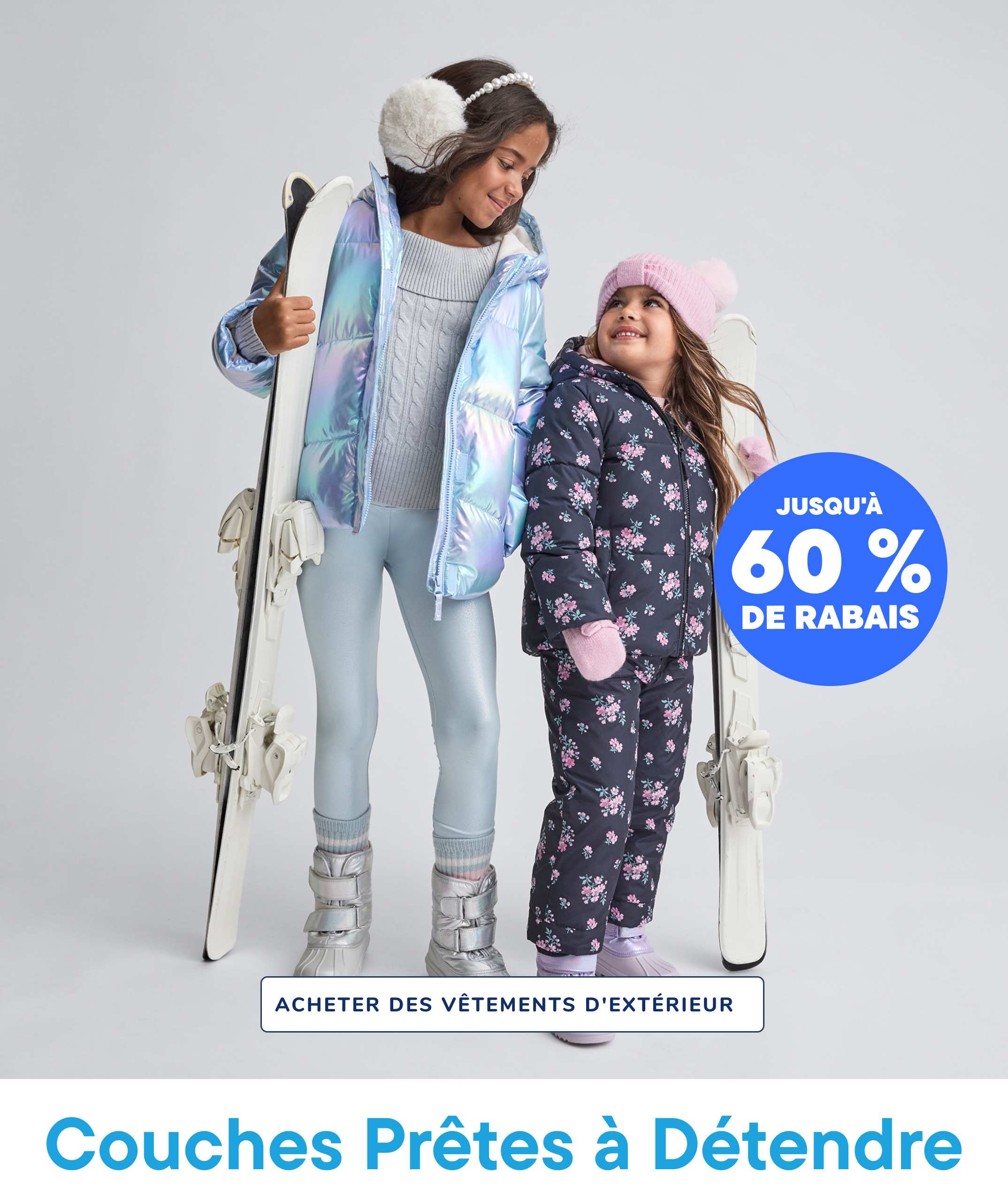 Two young girls wearing winter outfits and holding skis, with a large "XX% OFF" text overlay and a "SHOP OUTERWEAR" call-to-action in the background.