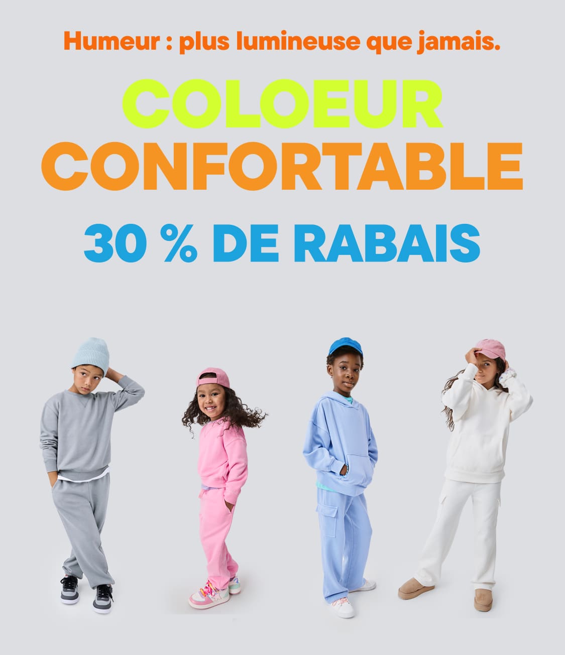 The image features a colorful advertisement for a clothing sale, showcasing a group of young models wearing vibrant, cozy-looking outfits against a plain background.