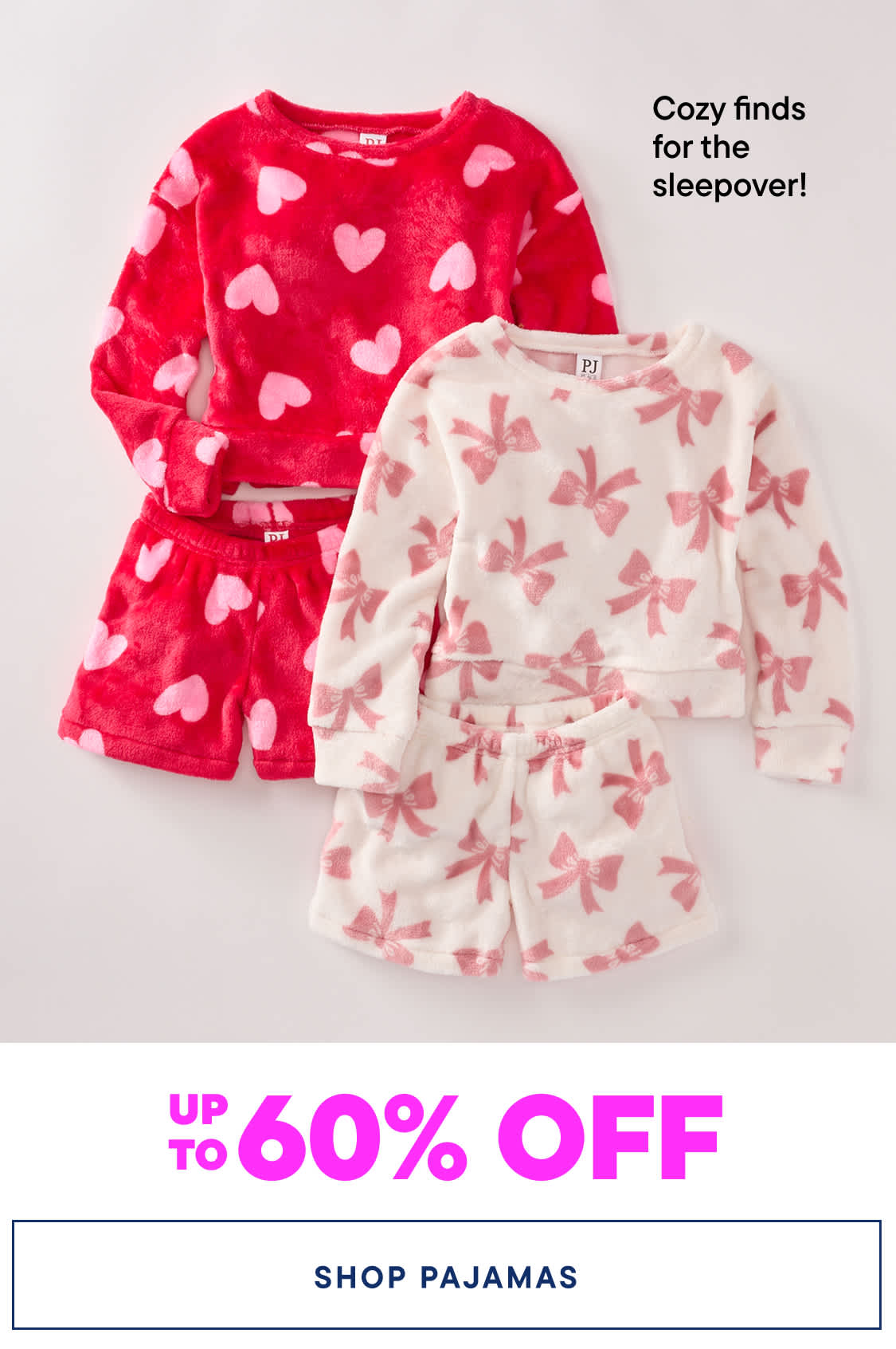 The image shows two pairs of cozy pajamas - one with a red heart pattern and the other with a pink butterfly pattern. The pajamas are displayed against a plain white background, with a "Cozy finds for the sleepover!" text overlay and a "UP TO 60% OFF" sale promotion for "SHOP PAJAMAS".