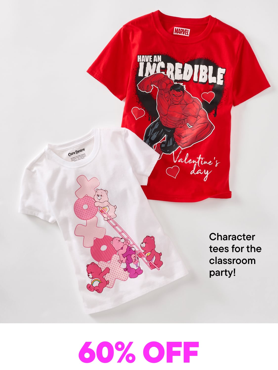 Two graphic t-shirts featuring Valentine's Day-themed designs, including a red shirt with a dinosaur graphic and a white shirt with a floral pattern, are displayed against a plain white background.