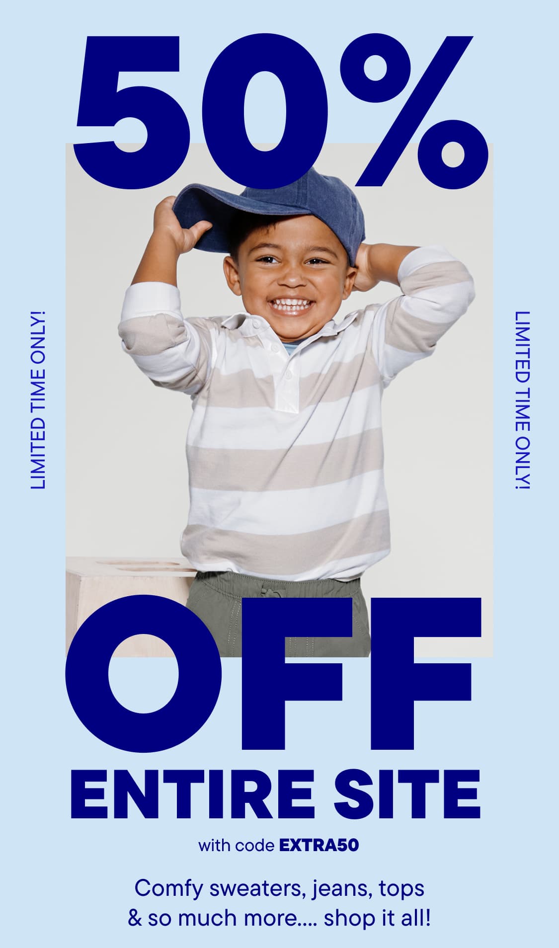 A smiling young boy wearing a white and blue striped shirt and a baseball cap stands in front of a large "50% OFF ENTIRE SITE" advertisement.
