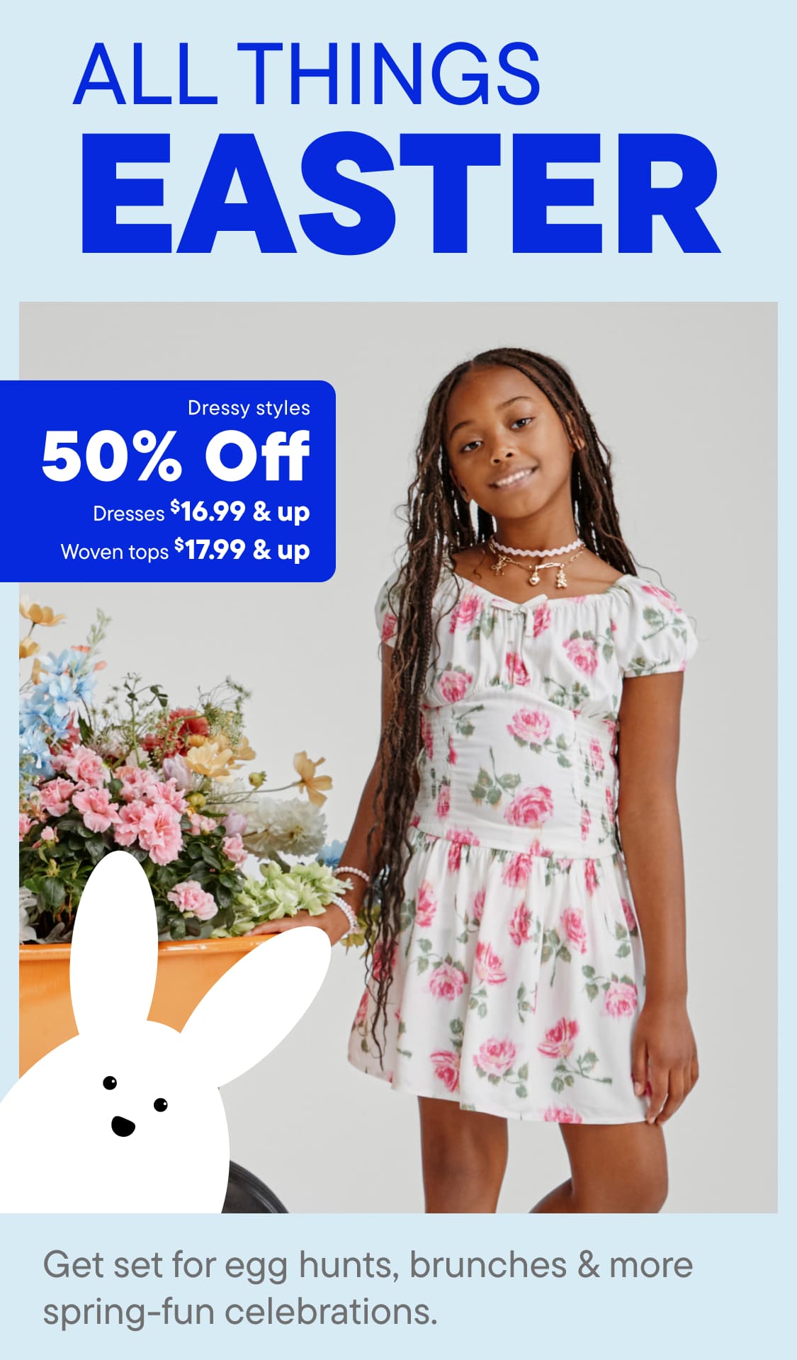 The image features a young girl wearing a floral dress standing in front of a display of Easter-themed items, including a large white rabbit and various spring-themed decorations.