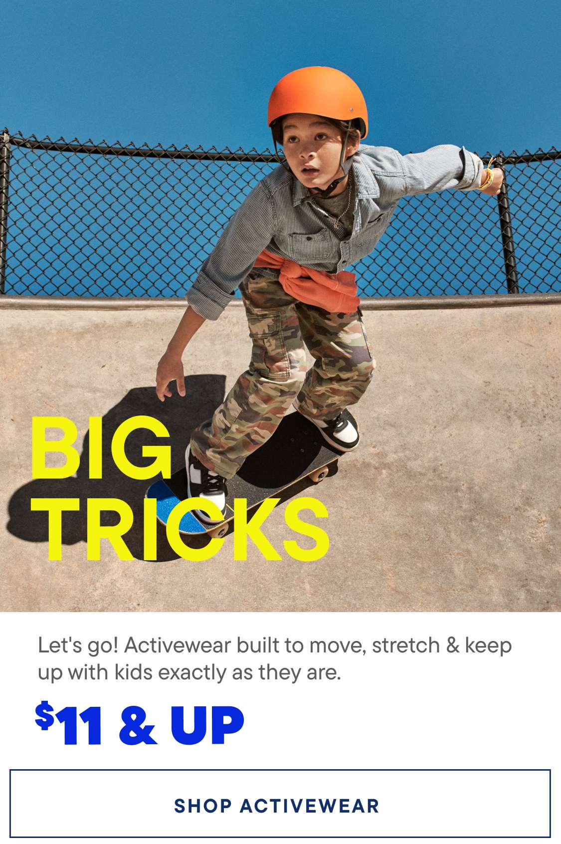 A young child wearing a safety helmet and camouflage clothing is shown performing a trick on a skateboard in front of a blue background with the text "BIG TRICKS" prominently displayed.
