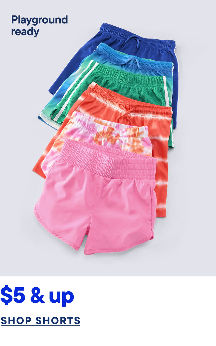 Colorful playground-ready shorts in various vibrant hues, including blue, green, and pink, are displayed against a plain white background.