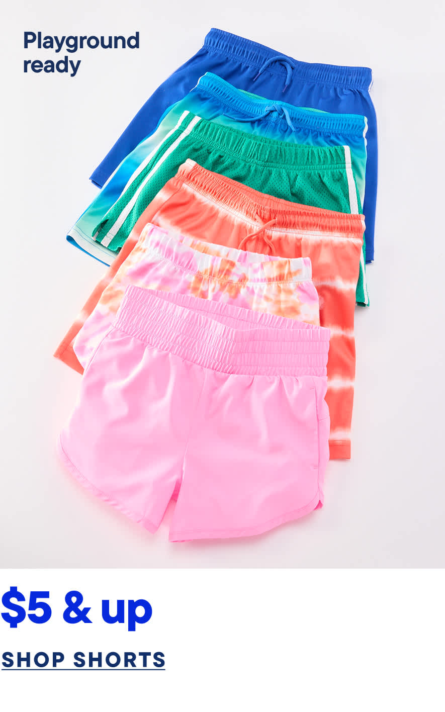 Colorful playground-ready shorts in various vibrant hues, including blue, green, and pink, are displayed against a plain white background.