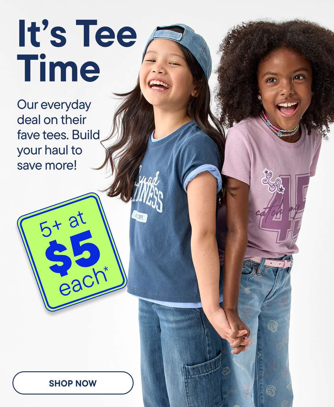 Two smiling girls in casual clothing stand in front of a light gray background, with a green sign advertising a sale on the left | 5+ at $5 EACH*