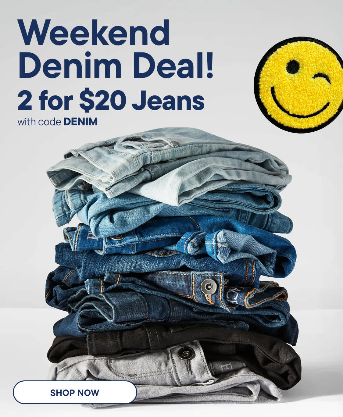 A tall stack of folded denim jeans in various shades of blue and grey fills the foreground, while the background features a Weekend Denim Deal! promotion with a winking smiley face.