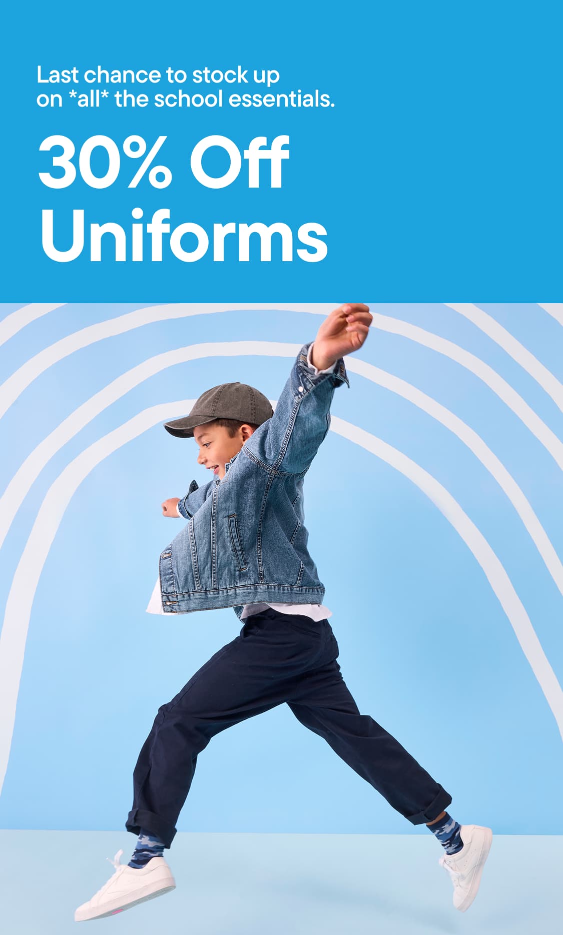 A young boy in a denim jacket and cap jumps in the foreground against a light blue background with white curved lines | 30% OFF UNIFORMS