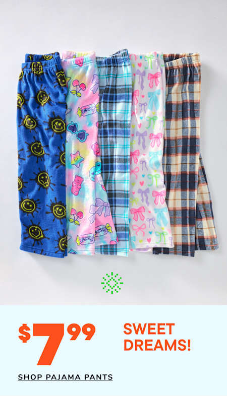 A collection of colorful and patterned pajama pants, including smiley faces, plaid, and floral designs, displayed on a white background with a price tag of $7.99 for "Sweet Dreams!" pajama pants.